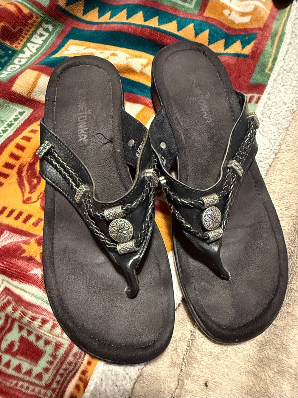 Minnetonka Black Braided Leather Toe-Post Sandals with Silver Accents